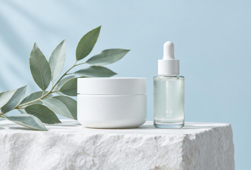 Unbranded skincare products on a stone plinth